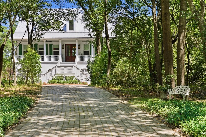 This elevated waterfront home with a private dock has been - photo 2