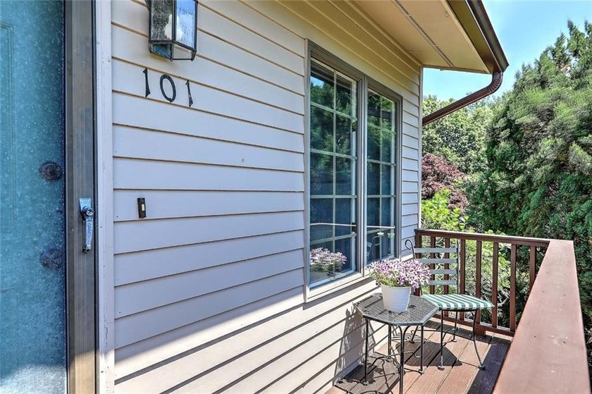 This well-maintained townhouse-style condominium is located in - photo 3
