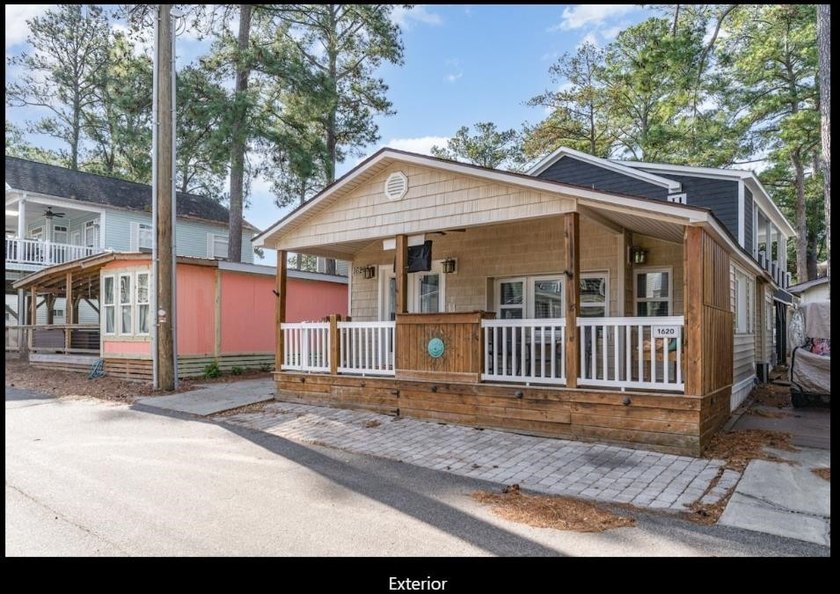 Cozy 2BR/2BA located within the prestigious and highly sought - photo 2