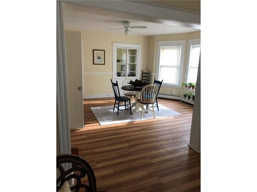 Welcome to this well-maintained 3 family home + 2 car garage - photo 2