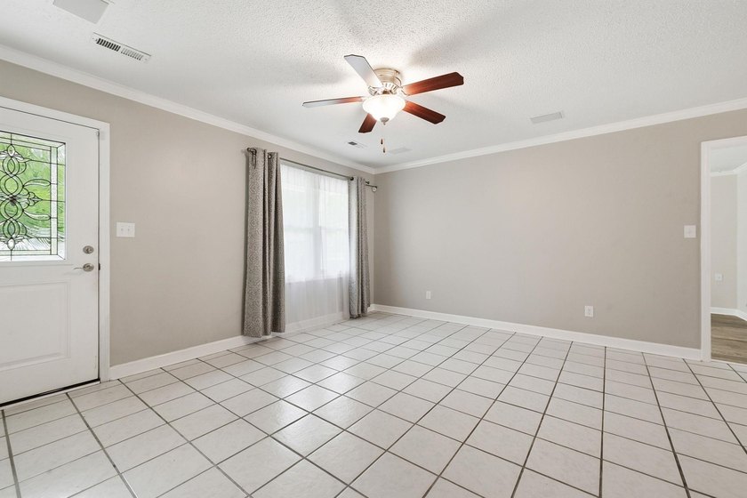Welcome home to this beautifully updated 3-bedroom, 2-bath brick - photo 3