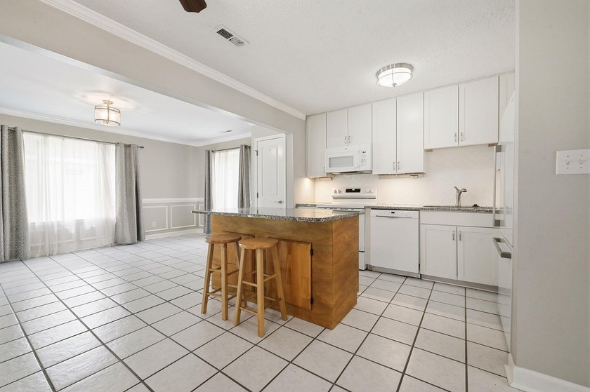 Welcome home to this beautifully updated 3-bedroom, 2-bath brick - photo 8