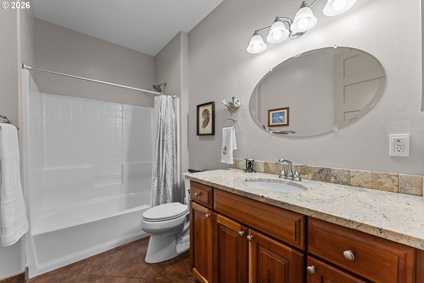 Coastal luxury meets comfort in this custom home within a - photo 34