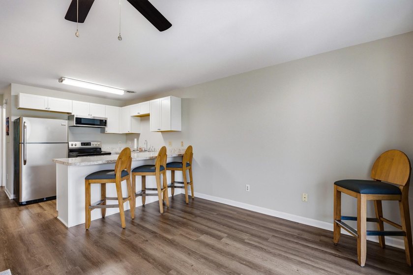 Enjoy comfortable coastal living in this bright and inviting - photo 5