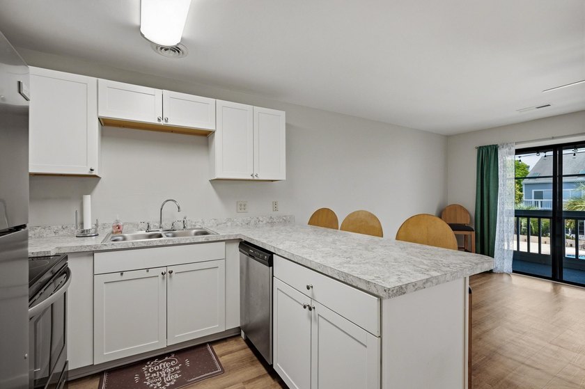 Enjoy comfortable coastal living in this bright and inviting - photo 7
