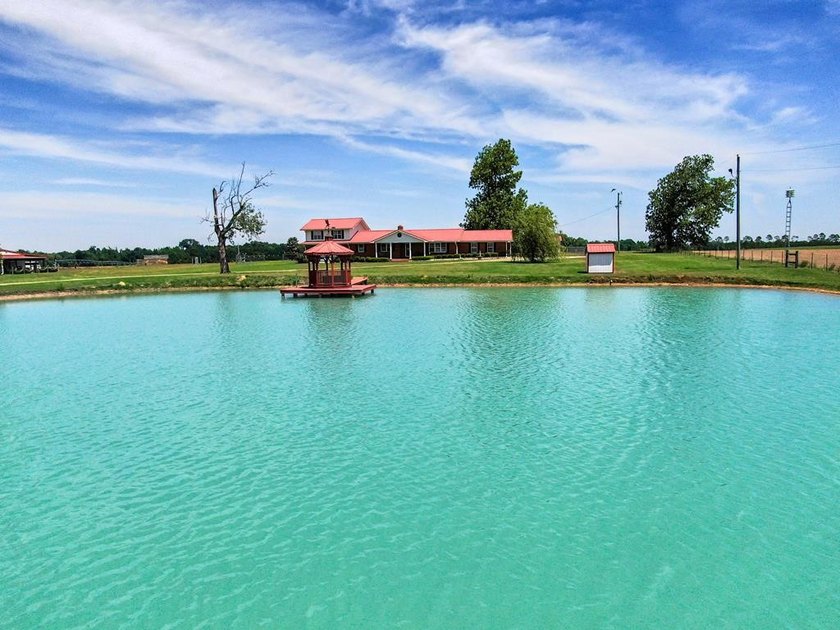 Known locally for the turquoise pond visible from the highway - photo 4