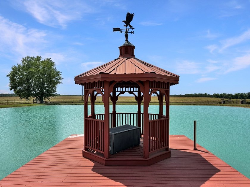 Known locally for the turquoise pond visible from the highway - photo 6