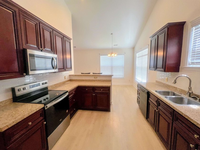 This home has a very inviting open floor plan and a breakfast - photo 9