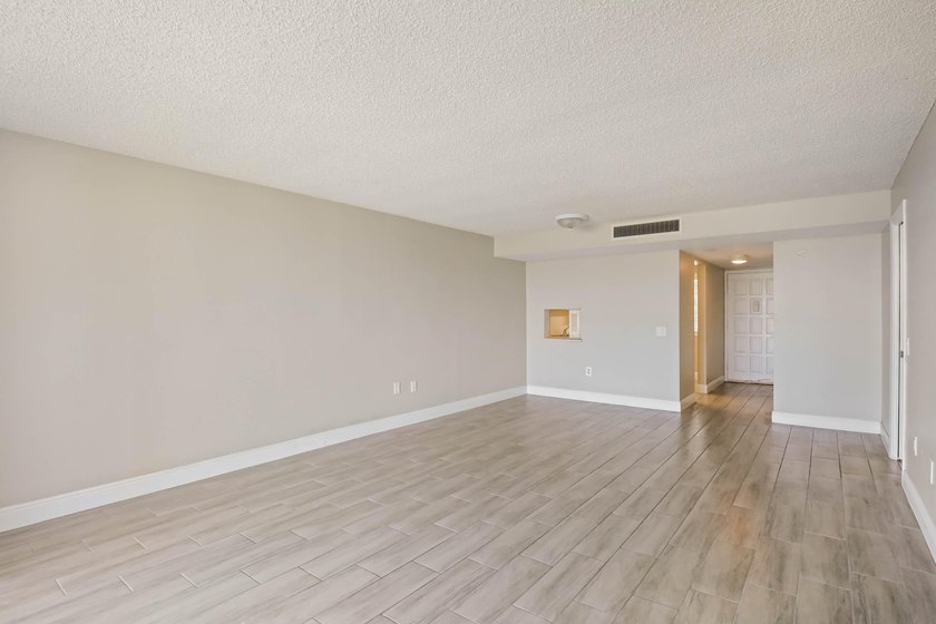 Beautiful 1-bedroom condo featuring updated flooring and a - photo 3