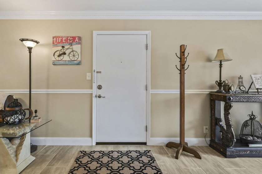Experience easy coastal living in this beautifully updated - photo 3