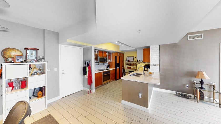 This 12th-floor unit in The Slade offers breathtaking views of - photo 9