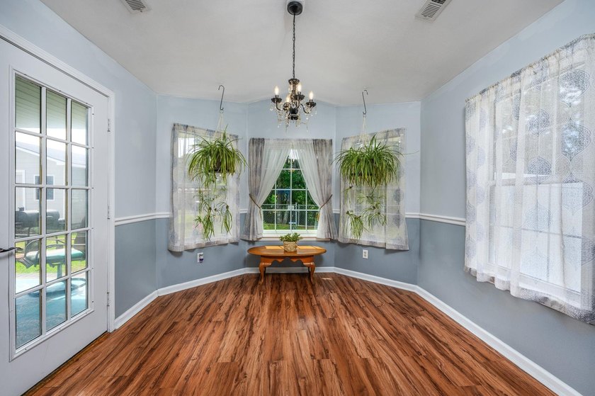 NO HOA, a fenced backyard overlooking the pond, and an updated - photo 6