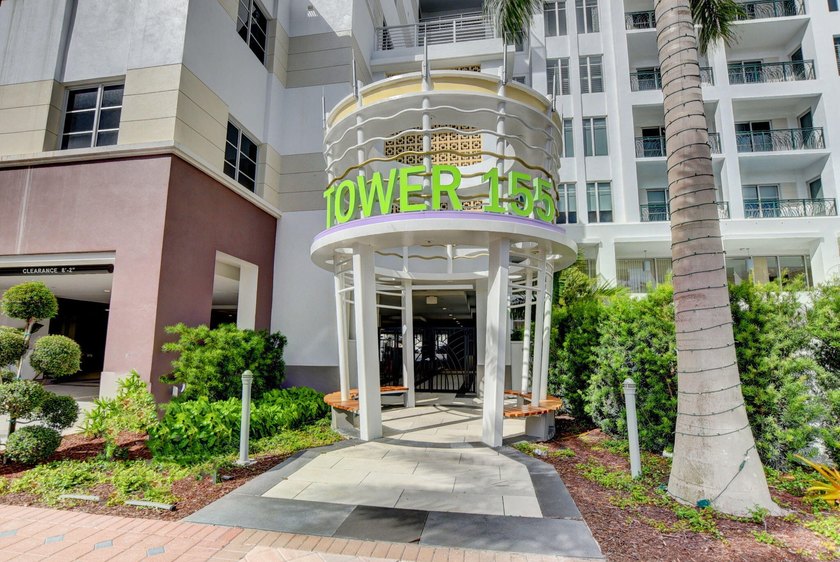 Experience refined townhouse-style living in the heart of - photo 2