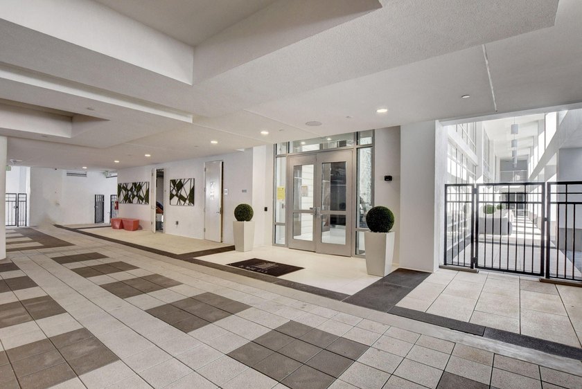 Experience refined townhouse-style living in the heart of - photo 4