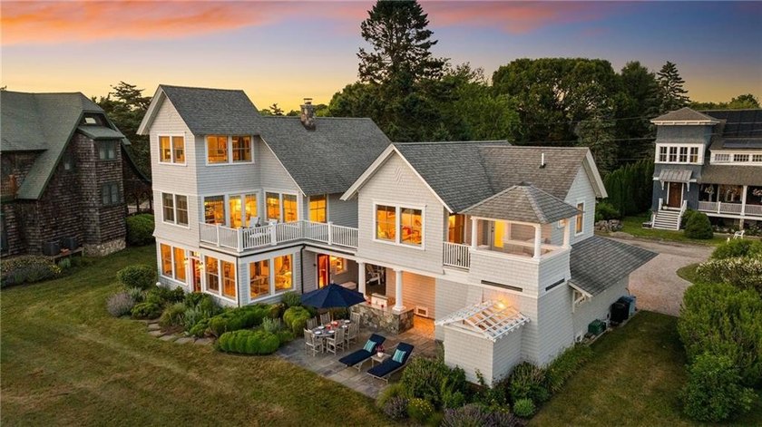 Perched at the water's edge, 19 Teal Drive is a custom-built - photo 2