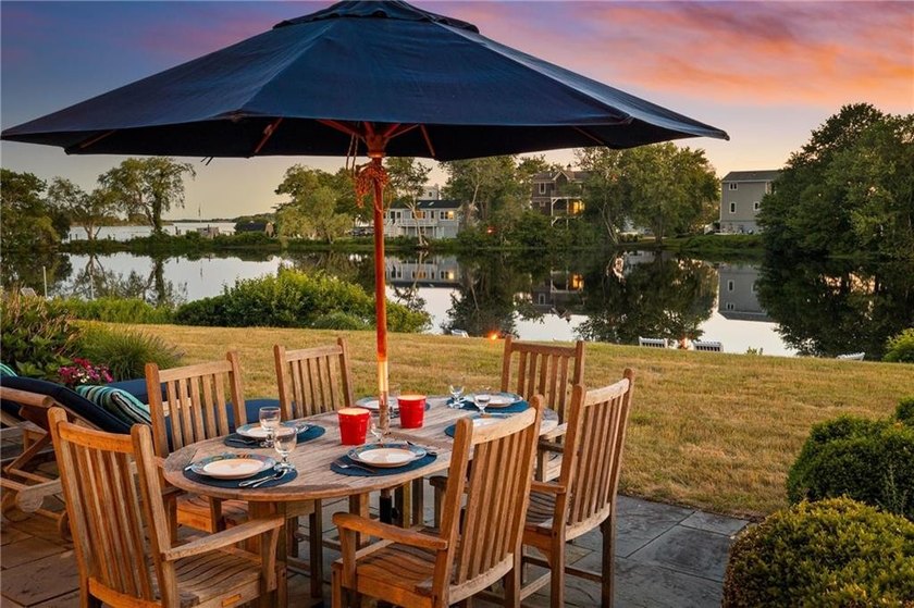 Perched at the water's edge, 19 Teal Drive is a custom-built - photo 4