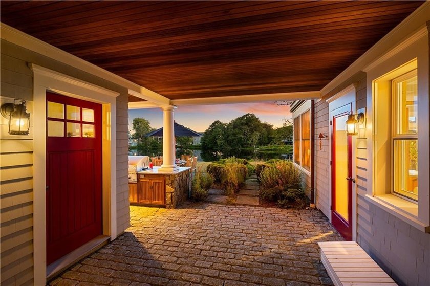 Perched at the water's edge, 19 Teal Drive is a custom-built - photo 6