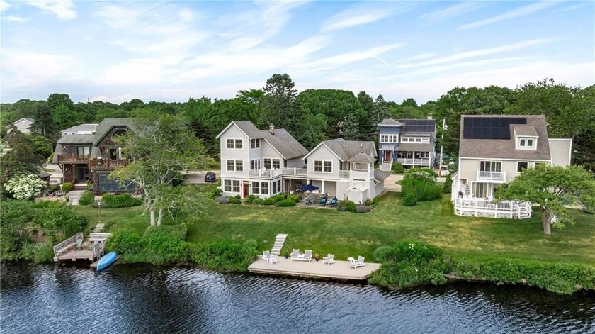 Perched at the water's edge, 19 Teal Drive is a custom-built - photo 7