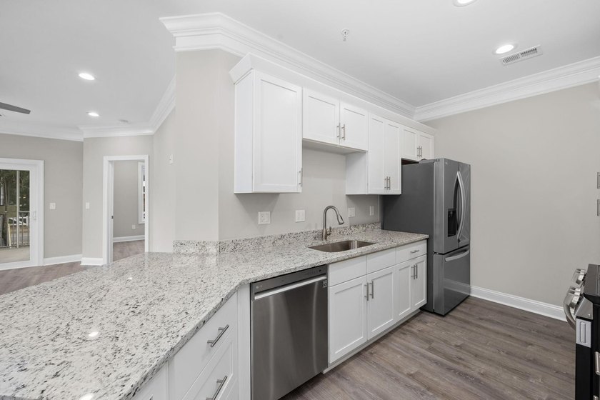 Indulge in coastal luxury with this stunning 3-bedroom - photo 10