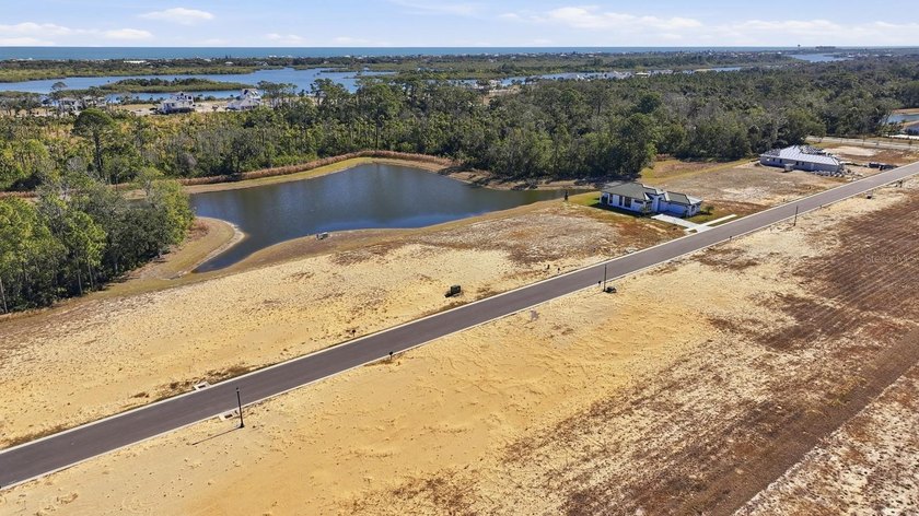 Cleared, and build-ready lot with Water Views located in the - photo 8