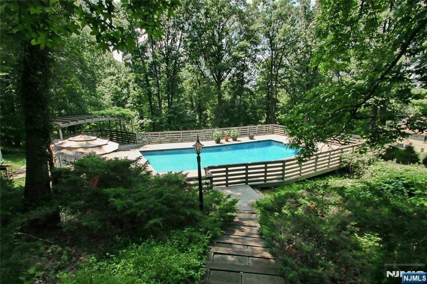 Beautifully updated ranch set atop a private 1.6-acre lot at the - photo 17