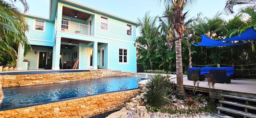 Price reduced to Sell! Don't miss out on this ocean access, pool - photo 5