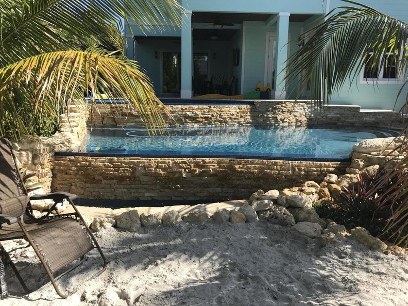 Price reduced to Sell! Don't miss out on this ocean access, pool - photo 8