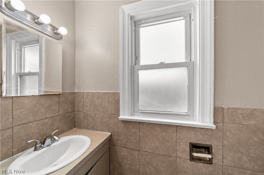 Welcome to 17904 Neff Rd in Euclid, a charming home located on a - photo 12
