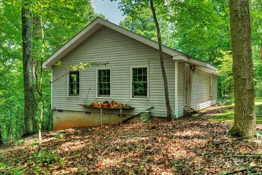 Charming cottage home nestled on nearly 7 private wooded acres - photo 37