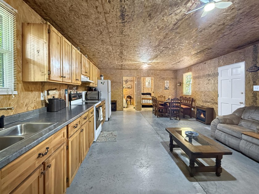 SECLUDED! Tucked away on 1.75 wooded acres, this cute 3-bedroom - photo 5