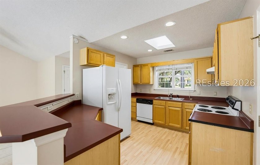 Set on a quiet street, 27 Telfair Drive offers a rare chance to - photo 13