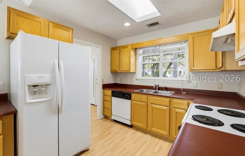 Set on a quiet street, 27 Telfair Drive offers a rare chance to - photo 16