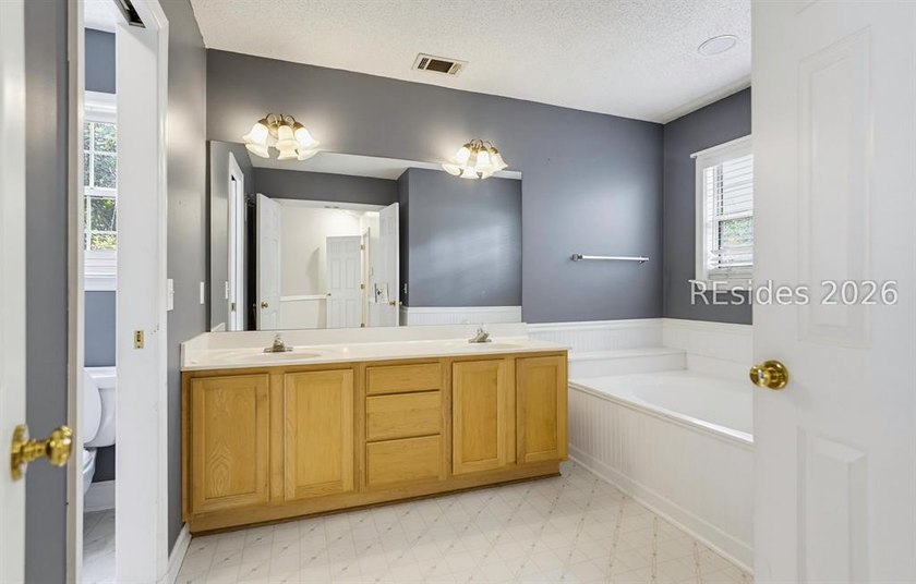 Set on a quiet street, 27 Telfair Drive offers a rare chance to - photo 29
