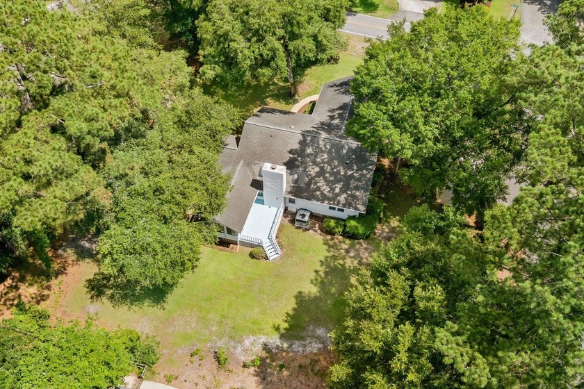 Nestled on a large, shaded 0.48-acre corner lot in the heart of - photo 5