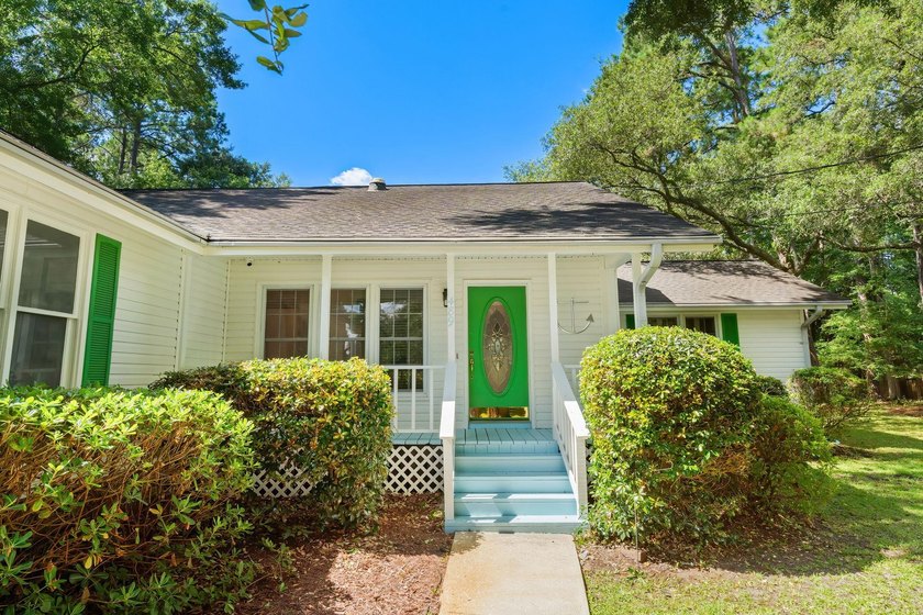 Nestled on a large, shaded 0.48-acre corner lot in the heart of - photo 7