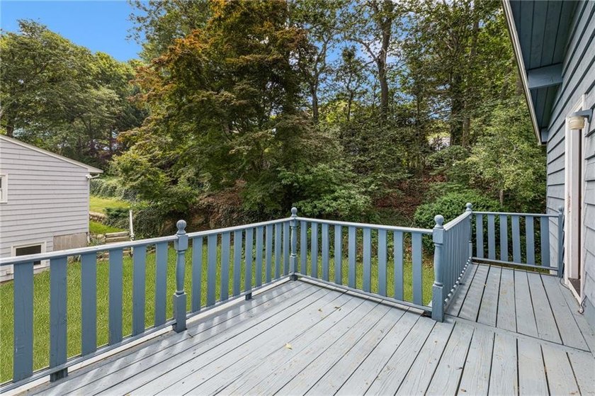 THIS OVERSIZED RAISED RANCH SITS IN A QUIET NEIGHBORHOOD IN - photo 10
