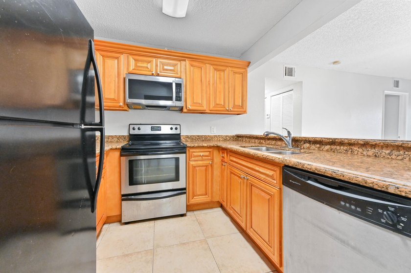 Step into this inviting 2-bedroom, 2-bath condo located in the - photo 3