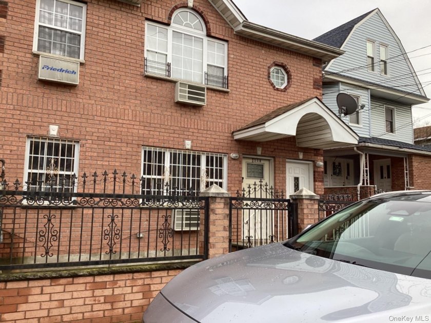 A rare find! This 19-year-young, brick-legal 2-family home is in - photo 2
