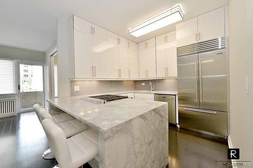 Step into sophisticated urban living in this stunning, barely - photo 6