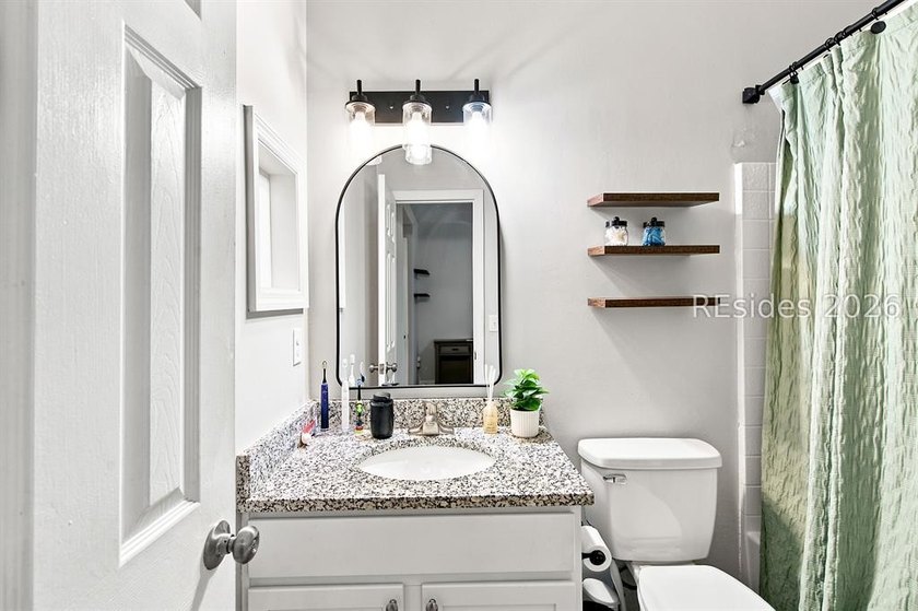 Welcome to this charming 4-bedroom, 2-bath home in the - photo 23