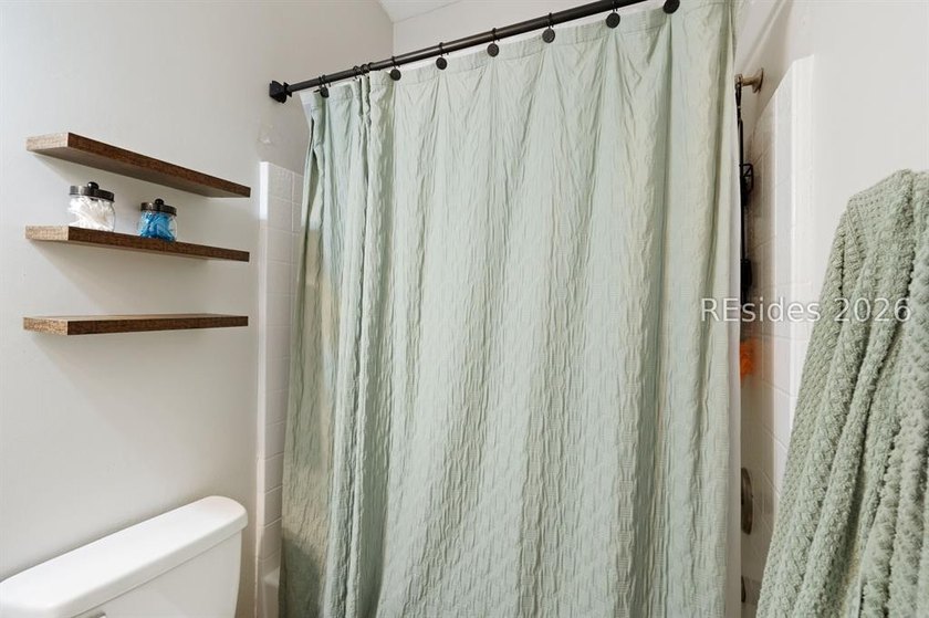 Welcome to this charming 4-bedroom, 2-bath home in the - photo 24