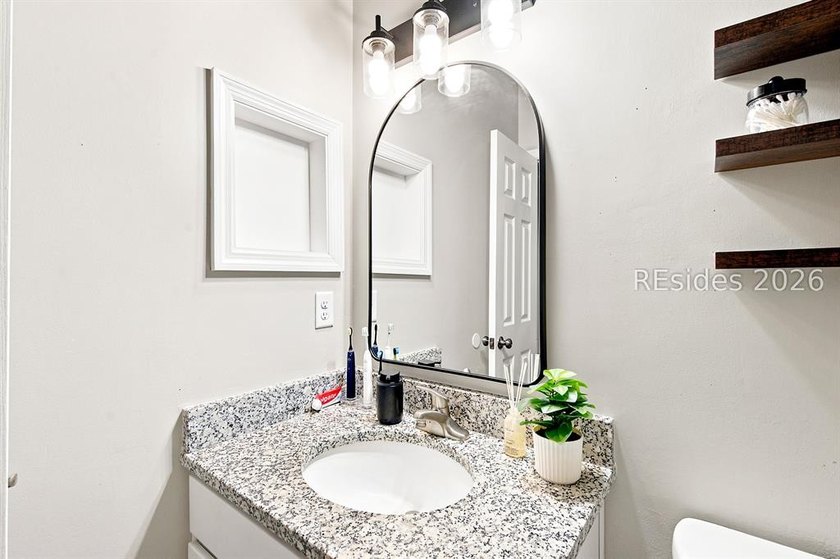 Welcome to this charming 4-bedroom, 2-bath home in the - photo 25