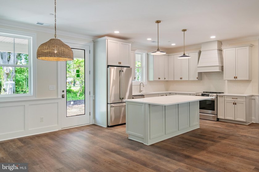 STUNNING NEW CONSTRUCTION located within the highly sought-after - photo 2