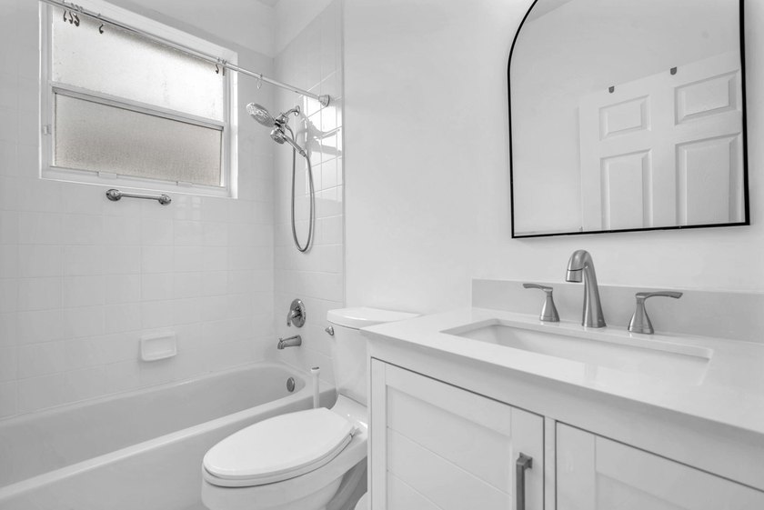 Welcome home to this beautifully updated villa in the highly - photo 20