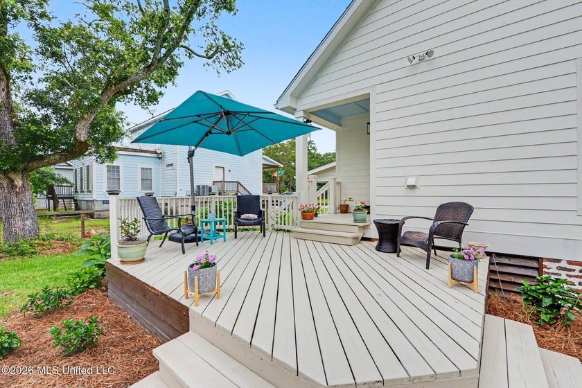 Nestled amongst majestic Live Oaks on one of Waveland's most - photo 23