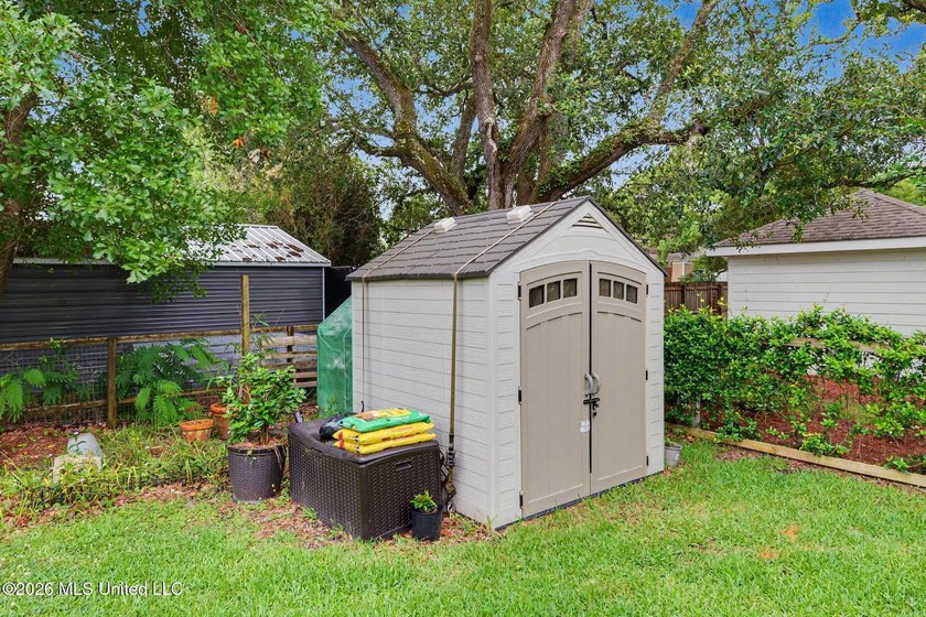 Nestled amongst majestic Live Oaks on one of Waveland's most - photo 24