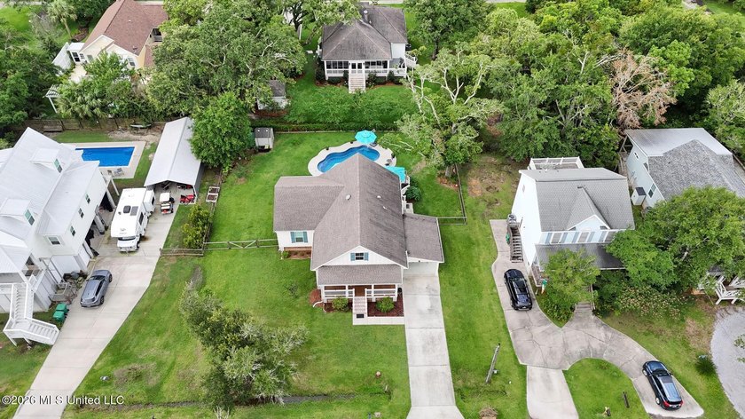 Nestled amongst majestic Live Oaks on one of Waveland's most - photo 29