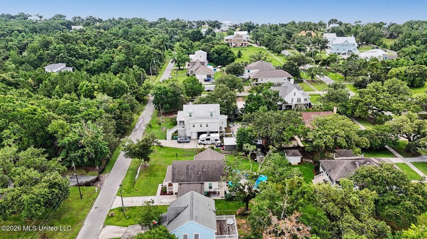 Nestled amongst majestic Live Oaks on one of Waveland's most - photo 31