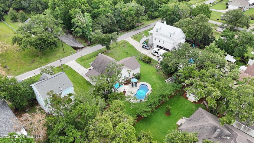 Nestled amongst majestic Live Oaks on one of Waveland's most - photo 32