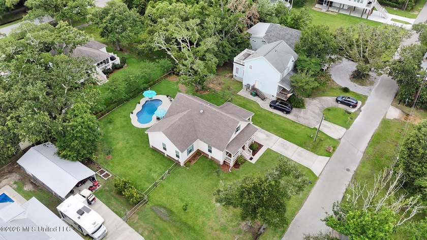 Nestled amongst majestic Live Oaks on one of Waveland's most - photo 36